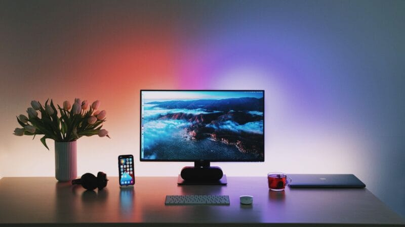 5 Essential Tips to improve your Work setup 4 Are you looking to elevate your desk or gaming setup? A well-organized and aesthetically pleasing workspace can significantly impact your productivity and overall well-being. a computer on a desk